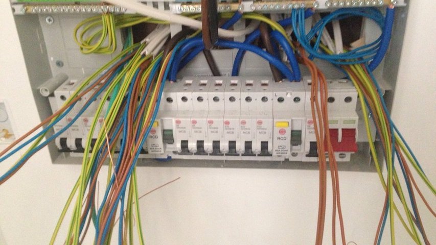 Cables awaiting termination in a new build Wylex board supplied by customer.
